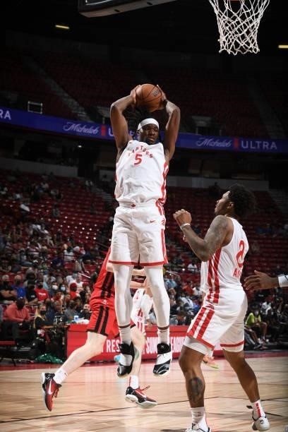 Precious Achiuwa of the Toronto Raptors rebounds the ball during the game against the Houston Rockets during the 2021 Las Vegas Summer League on...