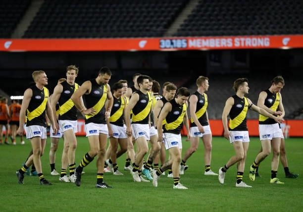 The Tigers look dejected after a loss during the 2021 AFL Round 22 match between the GWS Giants and the Richmond Tigers at Marvel Stadium on August...