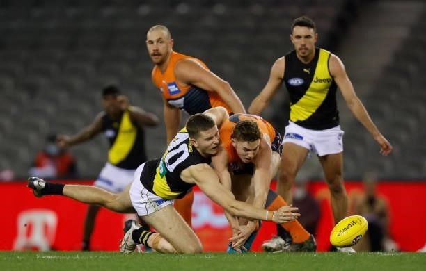 Callum Coleman-Jones of the Tigers and Tanner Bruhn of the Giants during the 2021 AFL Round 22 match between the GWS Giants and the Richmond Tigers...
