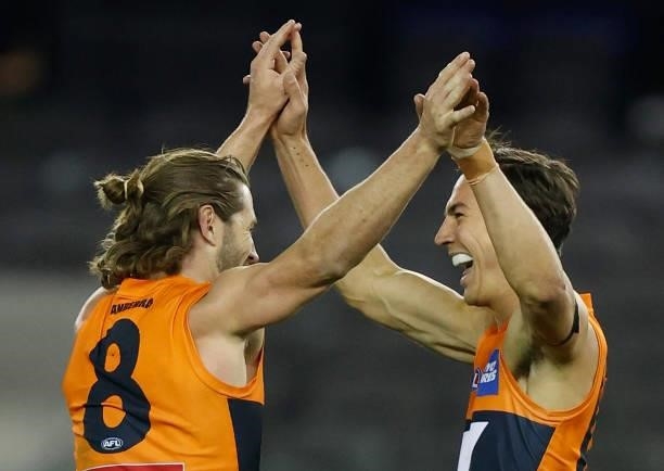 Callan Ward and Isaac Cumming of the Giants celebrate during the 2021 AFL Round 22 match between the GWS Giants and the Richmond Tigers at Marvel...
