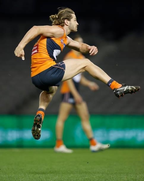 Callan Ward of the Giants kicks the ball during the 2021 AFL Round 22 match between the GWS Giants and the Richmond Tigers at Marvel Stadium on...
