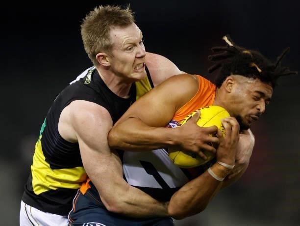 Connor Idun of the Giants is tackled by Jack Riewoldt of the Tigers during the 2021 AFL Round 22 match between the GWS Giants and the Richmond Tigers...