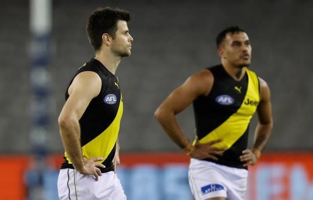 Sydney Stack and Trent Cotchin of the Tigers look dejected after a loss during the 2021 AFL Round 22 match between the GWS Giants and the Richmond...