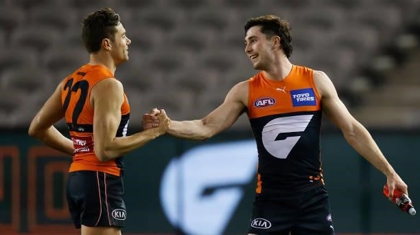 Josh Kelly and Lachie Ash of the Giants celebrate during the 2021 AFL Round 22 match between the GWS Giants and the Richmond Tigers at Marvel Stadium...