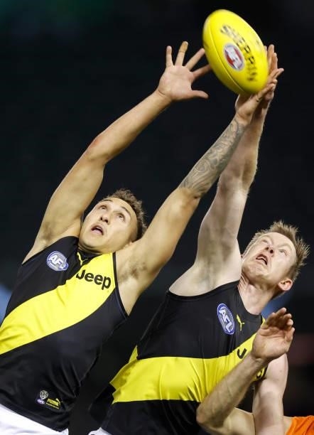 Shai Bolton of the Tigers and Jack Riewoldt of the Tigers compete for the ball during the 2021 AFL Round 22 match between the GWS Giants and the...
