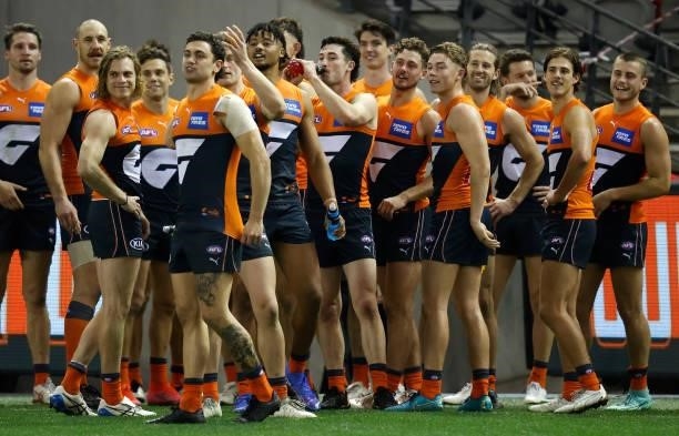 The Giants celebrate during the 2021 AFL Round 22 match between the GWS Giants and the Richmond Tigers at Marvel Stadium on August 13, 2021 in...