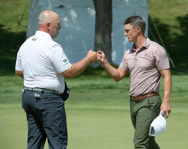 Scott Gutschewski and Blayne Barber bump fist on the 18th green during the second round of the Korn Ferry Tours Pinnacle Bank Championship presented...