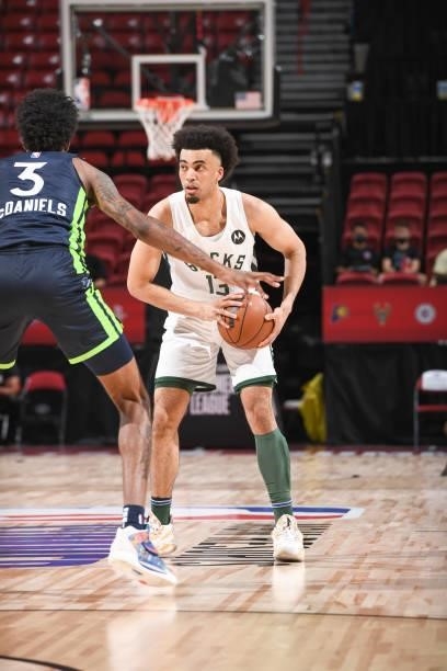 Jordan Nwora of the Milwaukee Bucks handles the ball during the game against the Minnesota Timberwolves during the 2021 Las Vegas Summer League on...