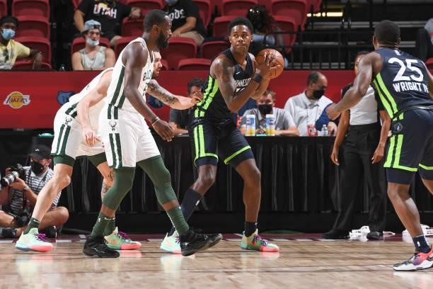 Nathan Knight of the Minnesota Timberwolves handles the ball during the game agains the Milwaukee Bucks during the 2021 Las Vegas Summer League on...