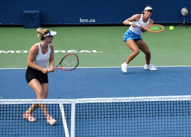 Luisa Stefani of Brazil and Gabriela Dabrowski of Canada play during their Womens Doubles Quarterfinals match against Elise Mertens of Belgium and...