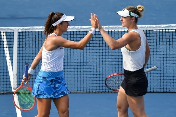 Luisa Stefani of Brazil and Gabriela Dabrowski of Canada encourage each other during their Womens Doubles Quarterfinals match against Elise Mertens...