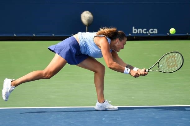 Aryna Sabalenka of Belarus reaches over for the ball during her Womens Doubles Quarterfinals match against Gabriela Dabrowski of Canada and Luisa...
