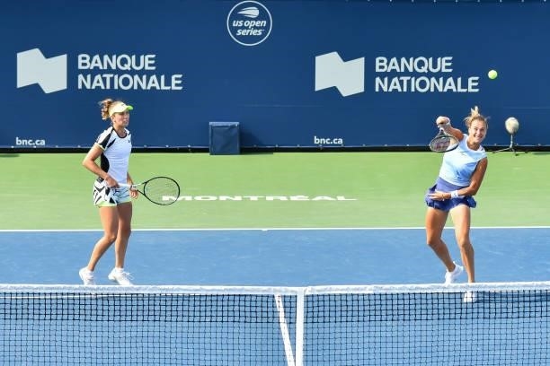 Elise Mertens of Belgium and Aryna Sabalenka of Belarus play during their Womens Doubles Quarterfinals match against Gabriela Dabrowski of Canada and...
