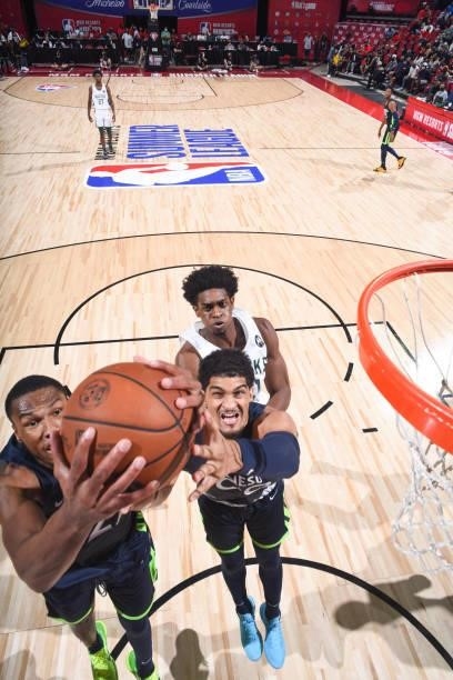 Kerry Blackshear Jr. #22 of the Minnesota Timberwolves and Cullen Russo of the Minnesota Timberwolves fight for the rebound during the game agains...