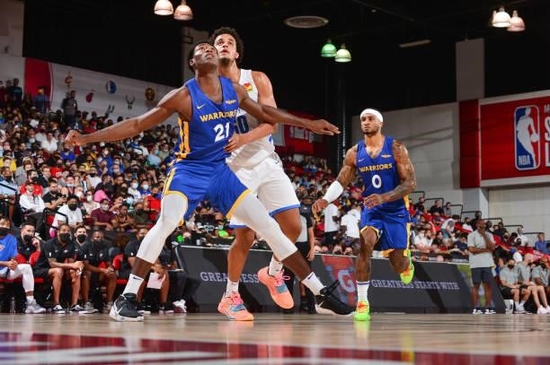 Selom Mawugbe of the Golden State Warriors and Jeremiah Robinson-Earl of the Oklahoma City Thunder fight for position during the 2021 Las Vegas...