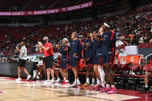 The New Orleans Pelicans bench cheers on their team during the game against the Cleveland Cavaliers during the 2021 Las Vegas Summer League on August...