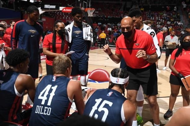 Fred Vinson, assistant coach of the New Orleans Pelicans talks with team during a timeout during the game against the Cleveland Cavaliers during the...