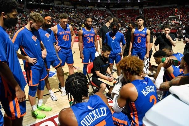 Daisuke Yoshimoto of the New York Knicks huddles with the team during the game against the Detroit Pistons during the 2021 Las Vegas Summer League on...