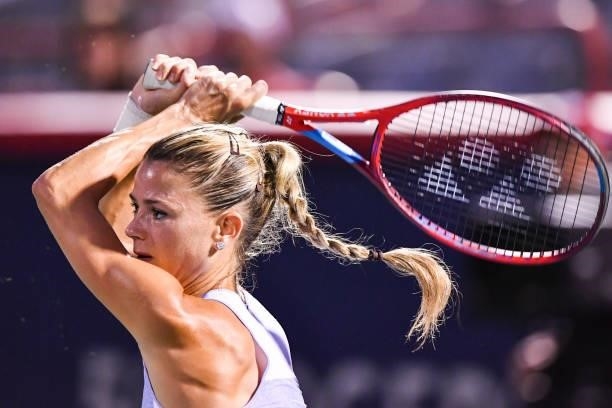 Camila Giorgi of Italy hits a return during her Womens Singles Quarterfinals match against Cori Gauff of the United States on Day Five of the...