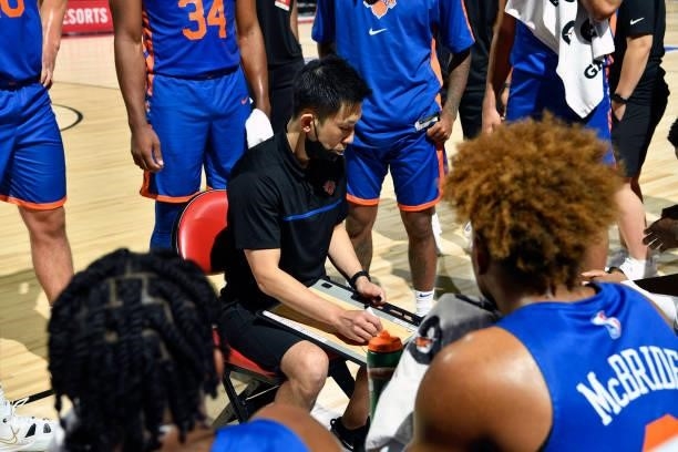 Daisuke Yoshimoto of the New York Knicks huddles with the team during the game against the Detroit Pistons during the 2021 Las Vegas Summer League on...