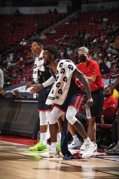 Didi Louzada of the New Orleans Pelicans and Naji Marshall of the New Orleans Pelicans cheer on teammates during the game against the Cleveland...