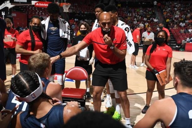 Fred Vinson, assistant coach of the New Orleans Pelicans talks with team during a timeout during the game against the Cleveland Cavaliers during the...