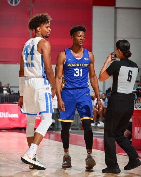 Charlie Brown Jr. #44 of the Oklahoma City Thunder and Eli Pemberton of the Golden State Warriors look on during the 2021 Las Vegas Summer League on...
