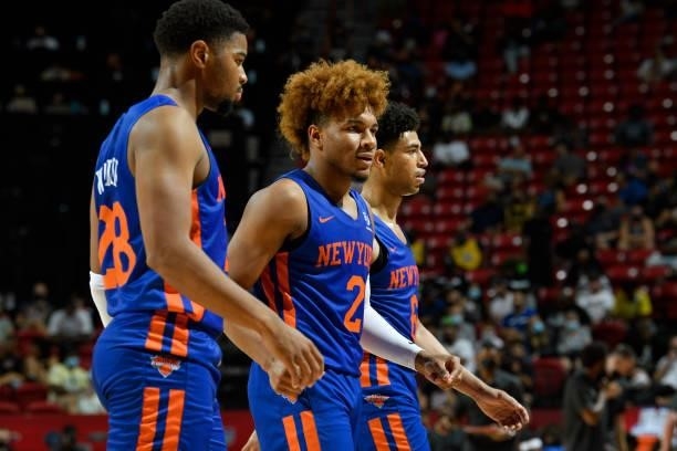 Miles McBride of the New York Knicks hi-fives teammates during the game against the Detroit Pistons during the 2021 Las Vegas Summer League on August...