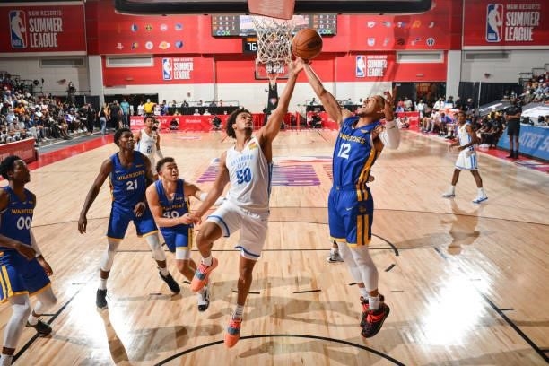 Jeremiah Robinson-Earl of the Oklahoma City Thunder and Kendall Smith of the Golden State Warriors fight for the rebound during the 2021 Las Vegas...