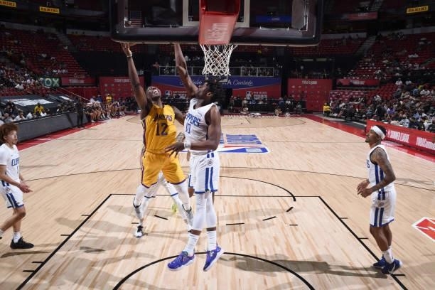 Devontae Cacok of the Los Angeles Lakers drives to the basket during the game against the LA Clippers during the 2021 Las Vegas Summer League on...