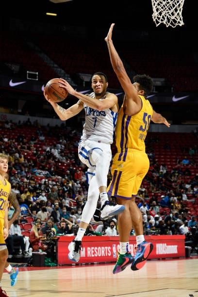Amir Coffey of the LA Clippers drives to the basket during the game against the Los Angeles Lakers during the 2021 Las Vegas Summer League on August...