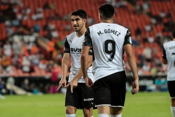 Carlos Soler of Valencia CF celebrate after scoring the 1-0 goal with his teammate Maxi Gomez during La liga match between Valencia CF and Getafe CF...