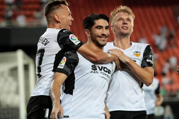 Carlos Soler of Valencia CF celebrate after scoring the 1-0 goal with his teammate Denis Cheryshev of Valencia CF and Daniel Wass of Valencia CF...