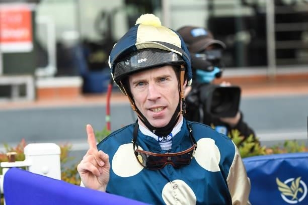 John Allen returns to the mounting yard after winning the P.B. Lawrence Stakes at Caulfield Racecourse on August 14, 2021 in Caulfield, Australia.