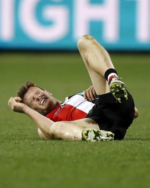 Darragh Joyce of the Saints lays injured during the 2021 AFL Round 22 match between the Geelong Cats and the St Kilda Saints at GMHBA Stadium on...