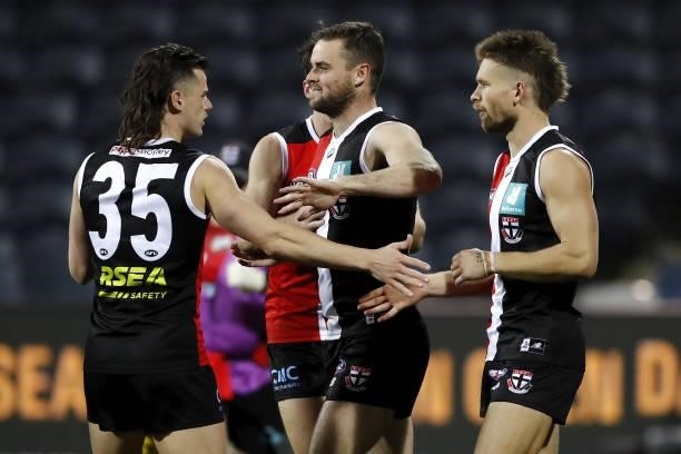 Brad Crouch of the Saints celebrates a goal with teammates during the 2021 AFL Round 22 match between the Geelong Cats and the St Kilda Saints at...