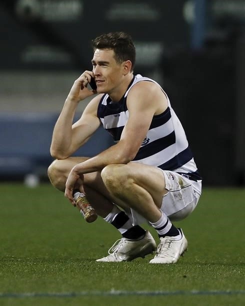 Jeremy Cameron of the Cats is seen on the phone after the 2021 AFL Round 22 match between the Geelong Cats and the St Kilda Saints at GMHBA Stadium...