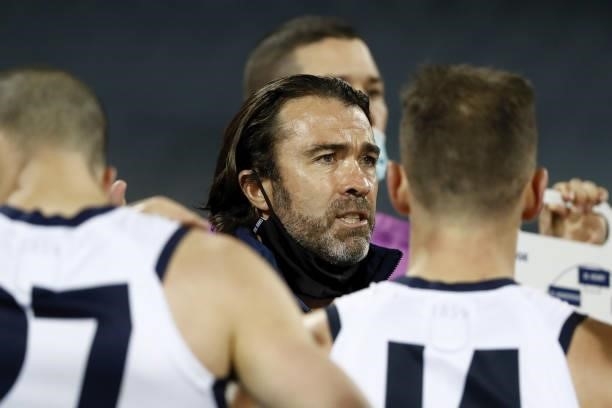 Senior coach Chris Scott of the Cats addresses his players during the 2021 AFL Round 22 match between the Geelong Cats and the St Kilda Saints at...