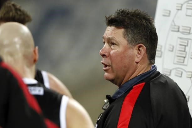 Senior coach Brett Ratten of the Saints addresses his players during the 2021 AFL Round 22 match between the Geelong Cats and the St Kilda Saints at...