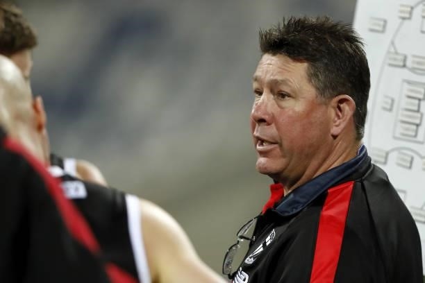 Senior coach Brett Ratten of the Saints addresses his players during the 2021 AFL Round 22 match between the Geelong Cats and the St Kilda Saints at...