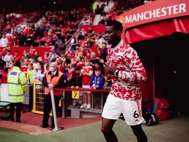 Paul Pogba of Manchester United runs out to warm up prior to the Premier League match between Manchester United and Leeds United at Old Trafford on...