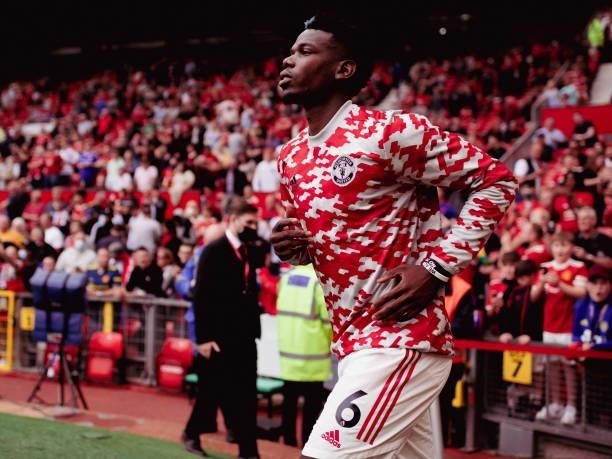 Paul Pogba of Manchester United runs out to warm up prior to the Premier League match between Manchester United and Leeds United at Old Trafford on...