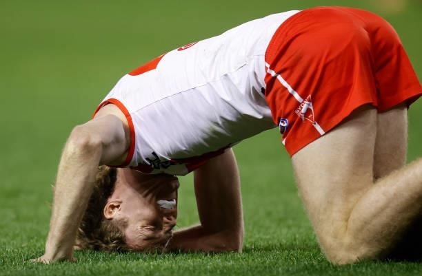 Nick Blakey of the Swans sustains an injury during the 2021 AFL Round 22 match between the North Melbourne Kangaroos and the Sydney Swans at Marvel...