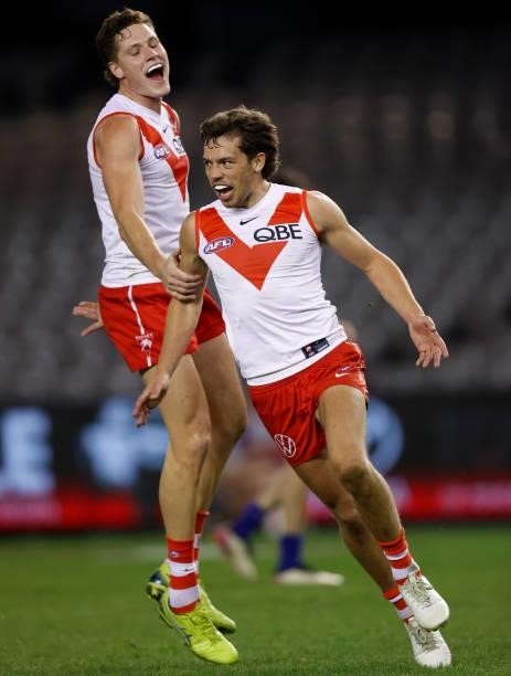 Hayden McLean and Oliver Florent of the Swans celebrate during the 2021 AFL Round 22 match between the North Melbourne Kangaroos and the Sydney Swans...