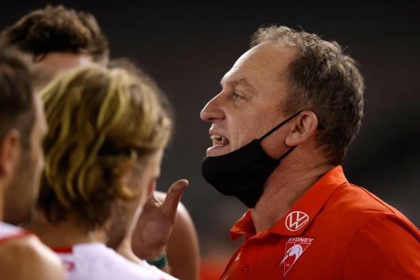 Senior coach John Longmire of the Swans addresses his players during the 2021 AFL Round 22 match between the North Melbourne Kangaroos and the Sydney...