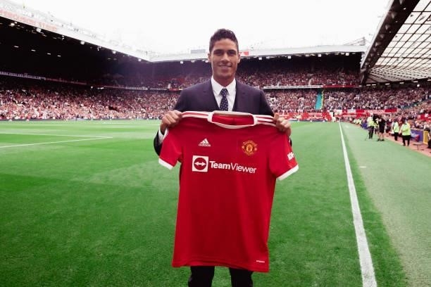 Raphael Varane of Manchester Unite poses with a shirt as he is unveiled prior to the Premier League match between Manchester United and Leeds United...