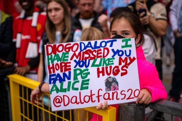 Manchester United fan shows a banner for Diogo Dalot during the Premier League match between Manchester United and Leeds United at Old Trafford on...