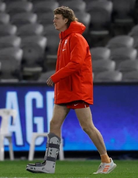 Nick Blakey of the Swans is seen in a moon boot during the 2021 AFL Round 22 match between the North Melbourne Kangaroos and the Sydney Swans at...