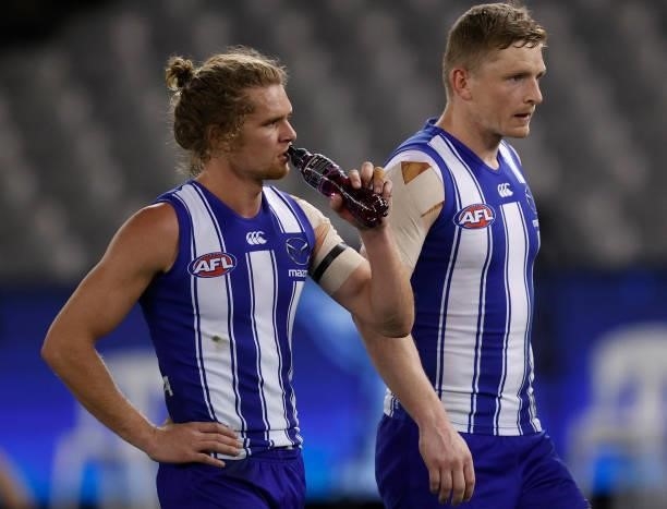 Jed Anderson and Jack Ziebell of the Kangaroos look dejected after a loss during the 2021 AFL Round 22 match between the North Melbourne Kangaroos...