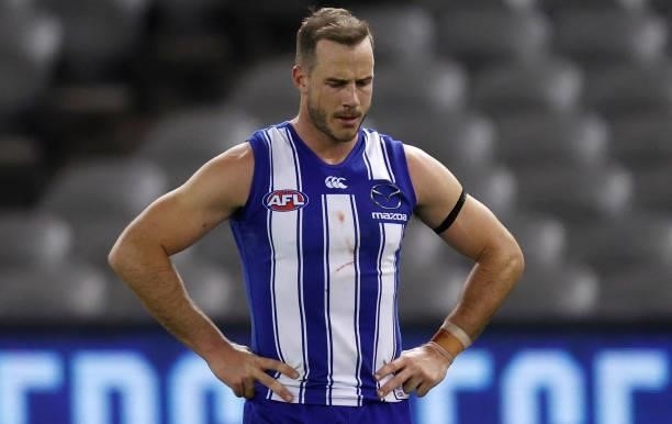 Josh Walker of the Kangaroos looks dejected after a loss during the 2021 AFL Round 22 match between the North Melbourne Kangaroos and the Sydney...